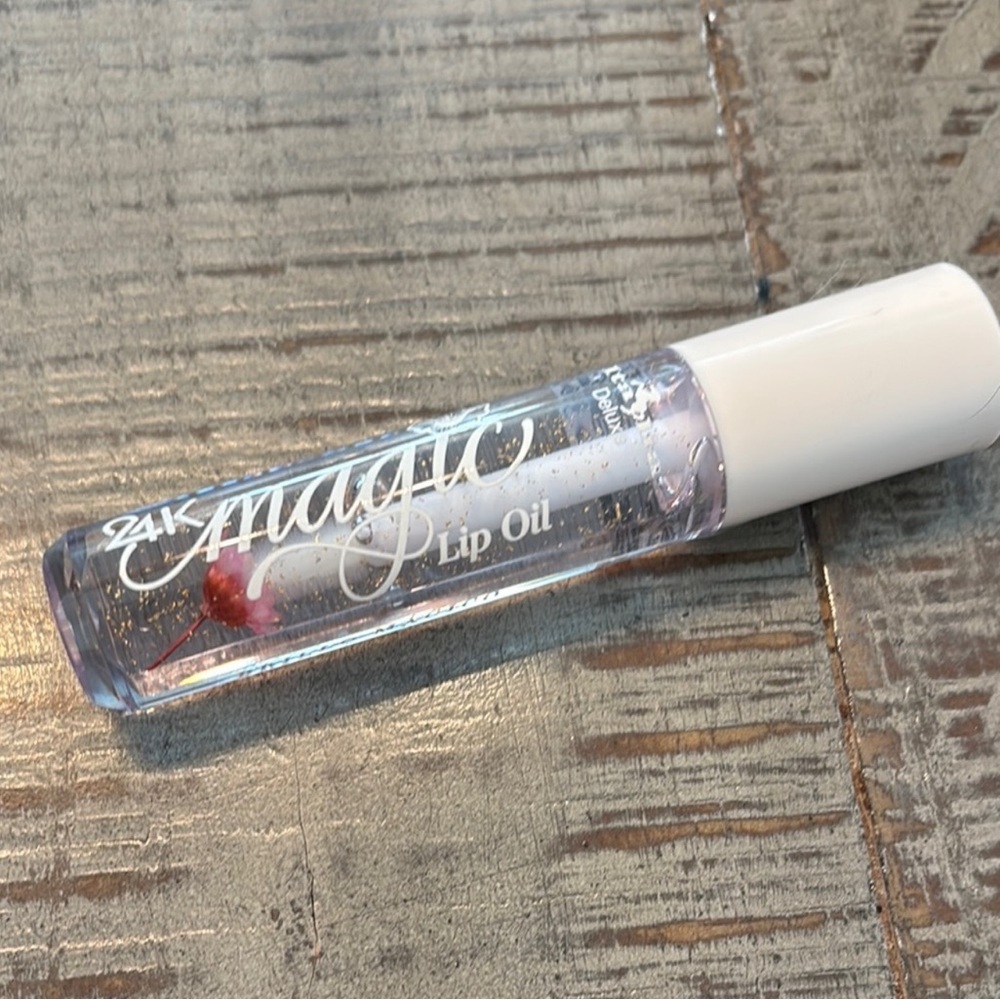 24k NWT Magic Lip Oil with pink flower infusion 2/$13 or 1/$8